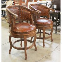 Pair of Embossed Leather Swivel Counter Stools
