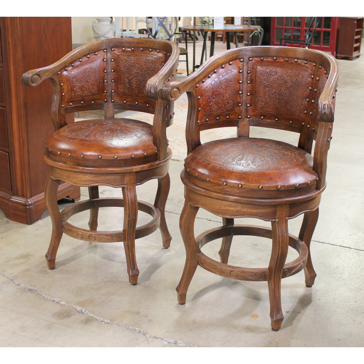 Pair of Embossed Leather Swivel Counter Stools