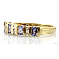 .64ctw Oval Tanzanite .08ctw Diamond 10K Gold Band