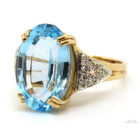 14K Gold Oval Blue Topaz & .13ctw Diamond Ring
