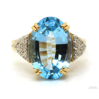 14K Gold Oval Blue Topaz & .13ctw Diamond Ring